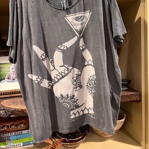 Magnolia Pearl distressed Tee.  It has a small stain close to the thumb.